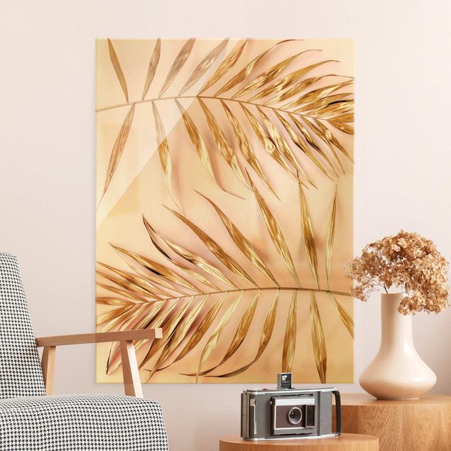 Obraz na szkle - Złote liście palmy na różowym tle