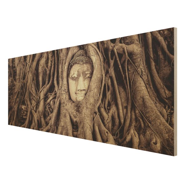 Obrazy drewniane Budda w Ayutthaya otoczony korzeniami drzew w kolorze brązowym