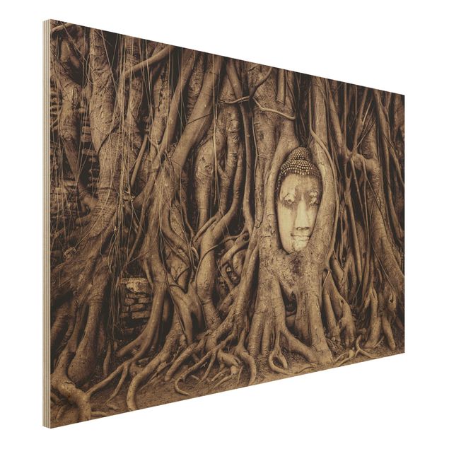Dekoracja do kuchni Budda w Ayutthaya otoczony korzeniami drzew w kolorze brązowym