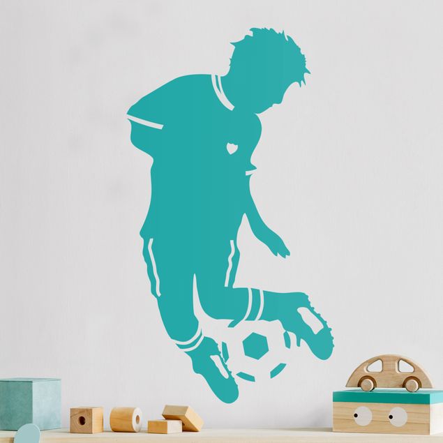 Naklejki na ścianę piłka nożna Mały piłkarz robi sztuczki