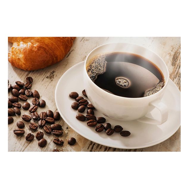 Nowoczesne obrazy Parująca filiżanka do kawy z ziarnami kawy