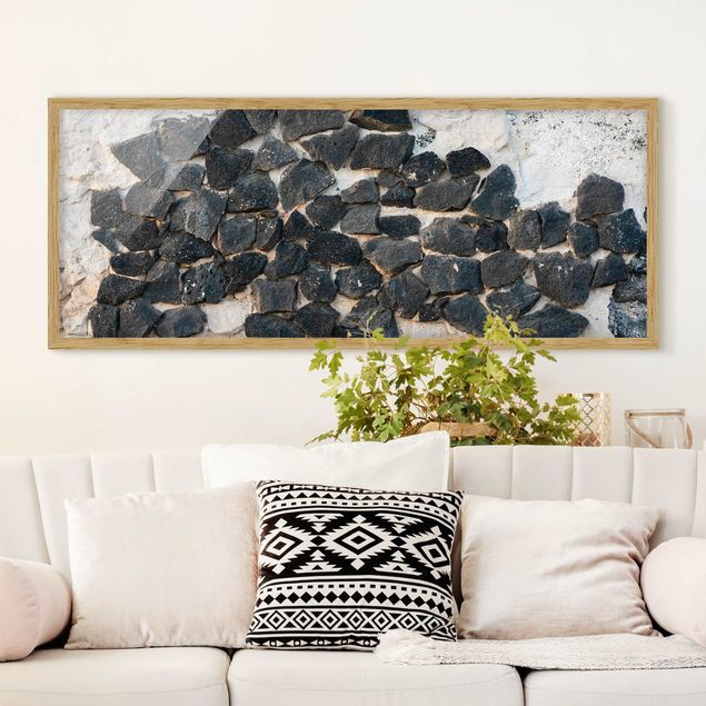 Nowoczesne obrazy do salonu Ściana z czarnymi kamieniami