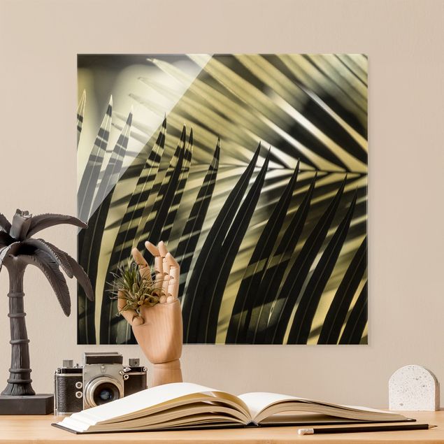 Obrazy na szkle kwadrat Gra cieni na liściu palmy