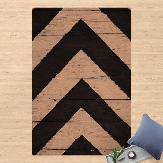 dywan nowoczesny Symetria na belkach drewnianych
