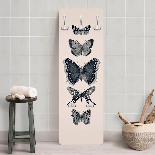 Garderoby Motyle z atramentu na beżowym tle