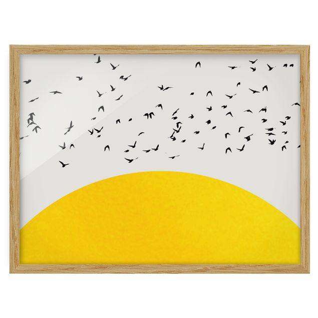 Obrazy w ramie do łazienki Stado ptaków na tle żółtego słońca